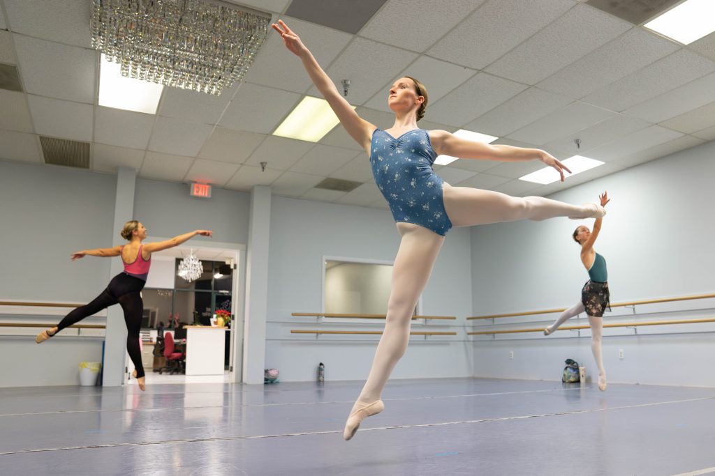 Three adult ballet 4 students doing a menage for their center grand allegro at the end of Mrs. Anne's class.