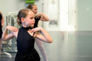 Level 2 ballet student ready to work on chaines turns across the floor in ballet class